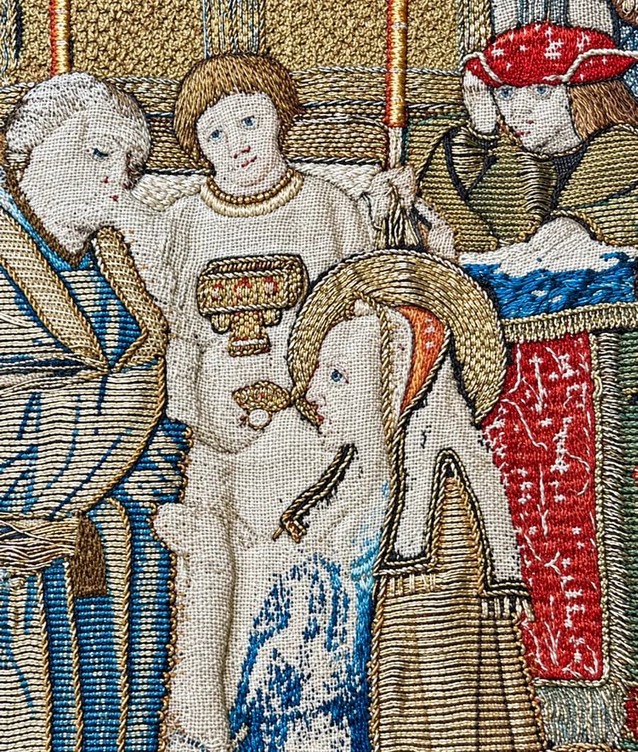 Medieval silk and gold embroidery of Saint Lucy, with a halo, receiving communion from a churchman, from Torskinge church in Småland