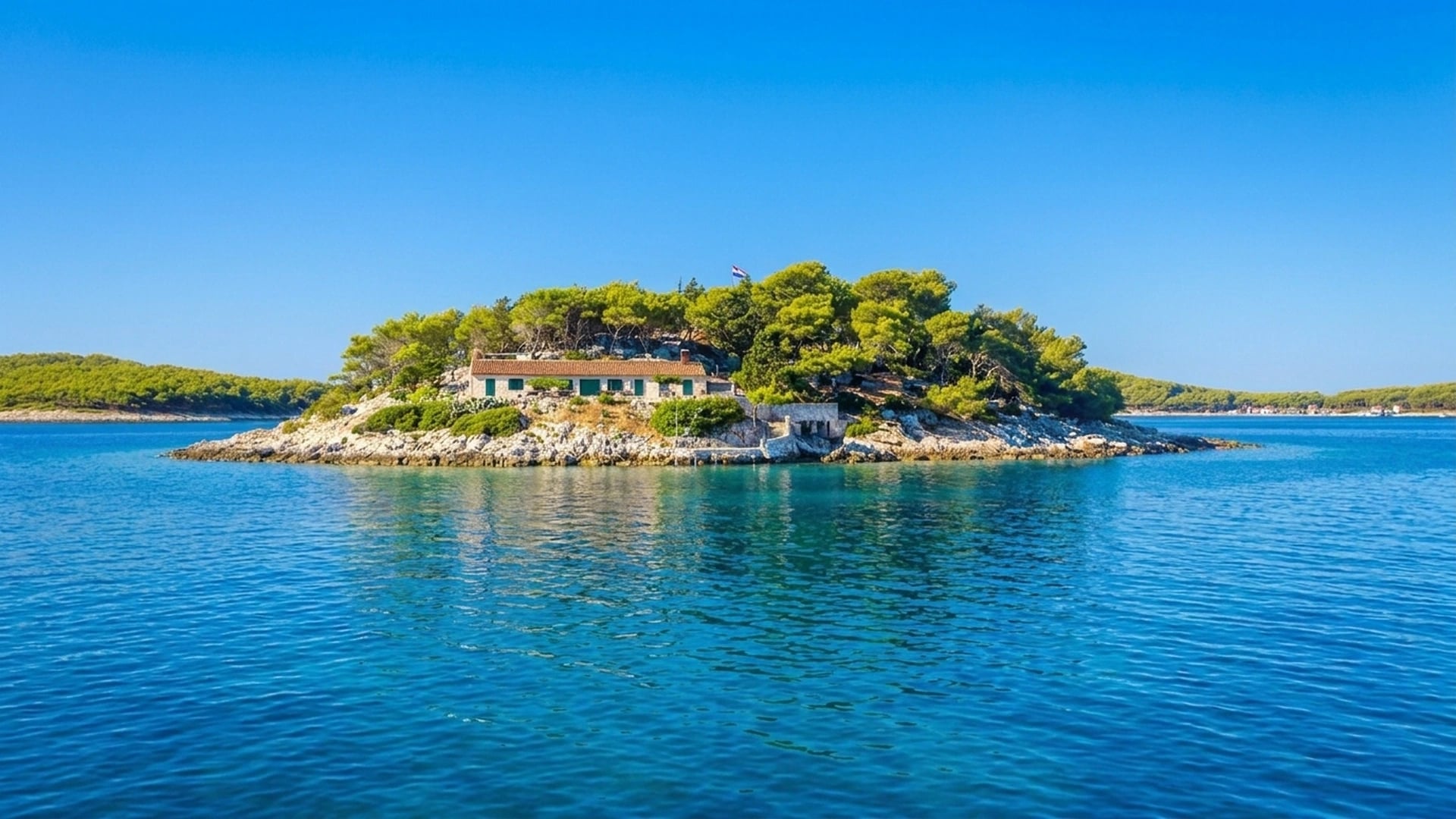 A car-free Elaphiti island with stone harbour and clear Adriatic water, near Dubrovnik, Croatia.