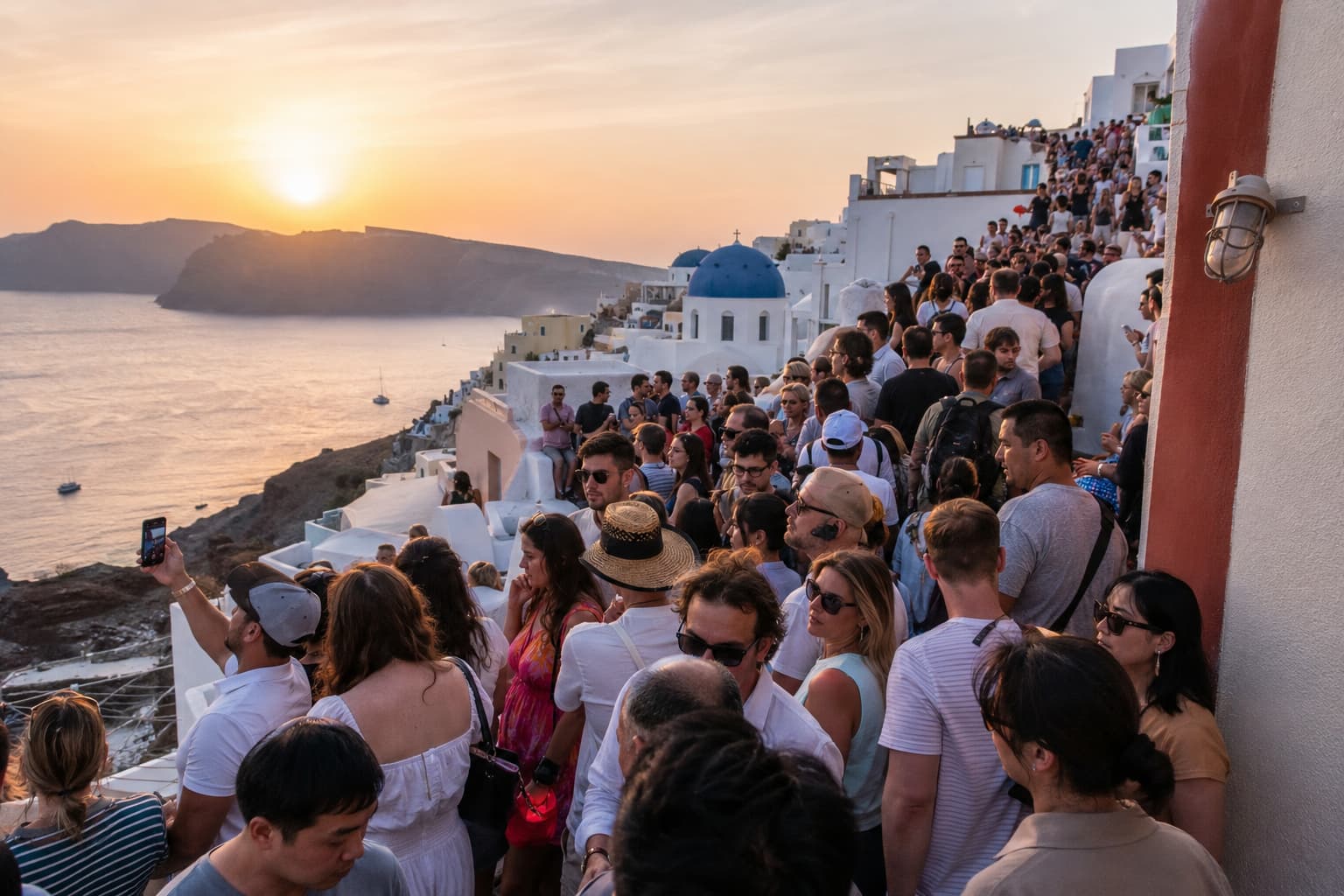 Crowds gathered for sunset in Oia, Santorini.